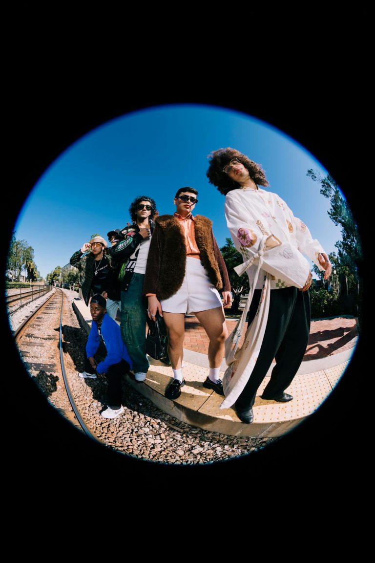 A group of stylish models posing on a railway track in Orlando.